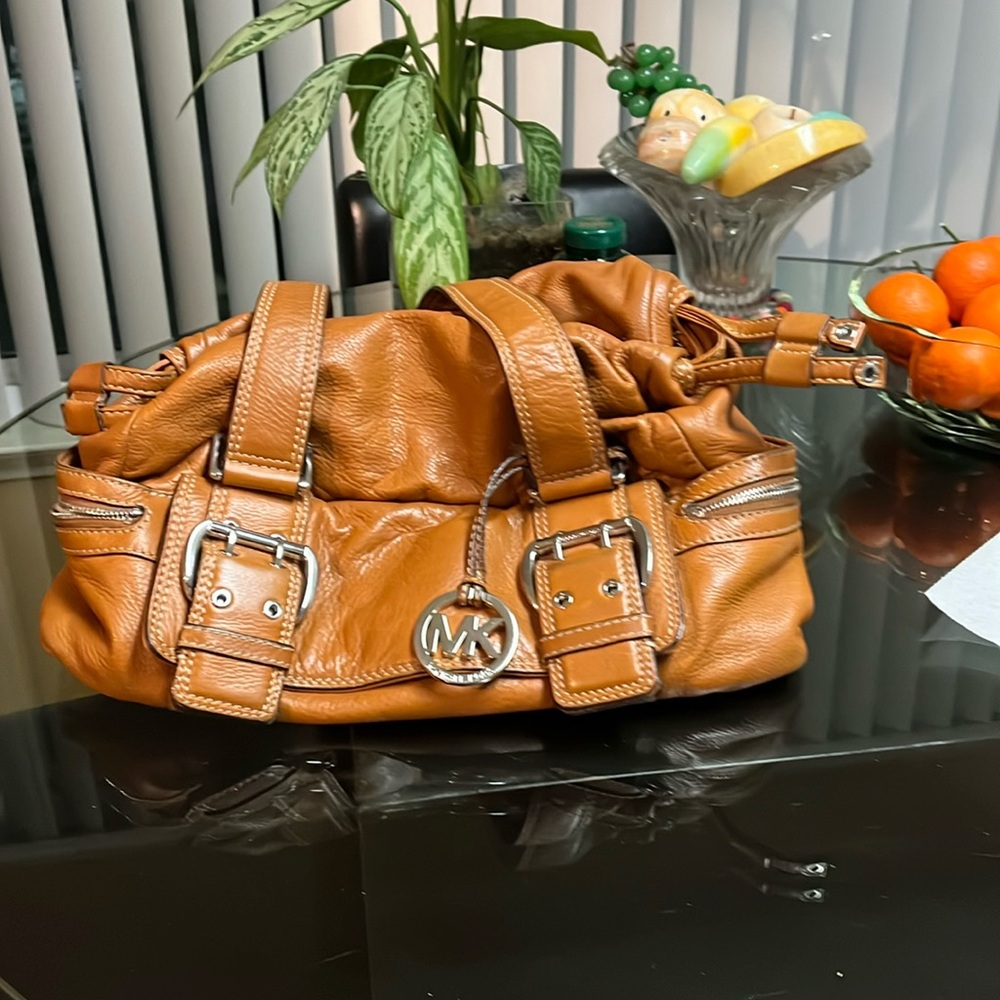 Michael Kors nice leather several compartments. Deep orangey tan